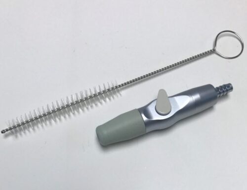 Suction adapter with cleaning brush